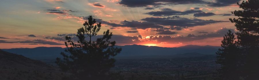 Scenic view of landscape against sky during sunset