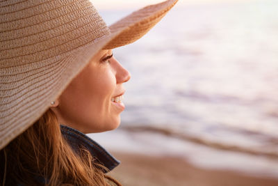 Portrait of woman looking away at beach