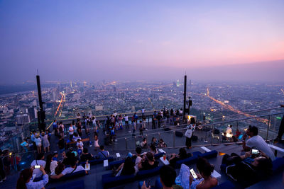 High angle view of people on city buildings