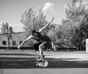 Full length of man skateboarding on skateboard