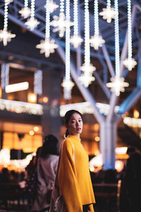 Full length of woman standing at night