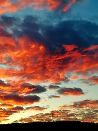 Low angle view of dramatic sky during sunset