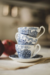 Close-up of tea cups on table