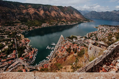 High angle view of lake with mountain range in background