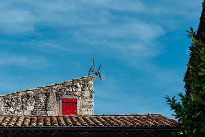 Low angle view of roof against sky