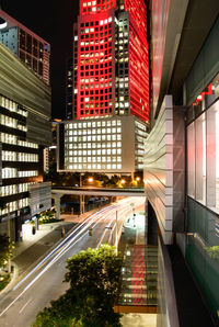 Illuminated road in city at night