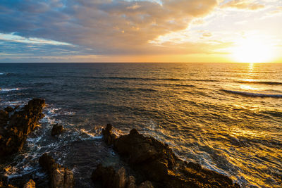 Scenic view of sea against sky during sunset