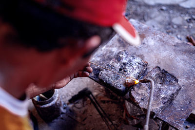 Low section of man holding fish
