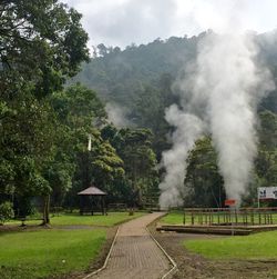 Scenic view of landscape against cloudy sky