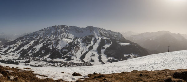 Scenic view of snowcapped mountains against sky