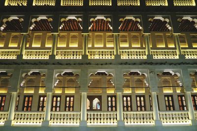 Low angle view of illuminated souq waqif at night