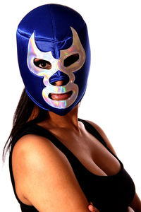 Portrait of woman wearing mask against white background