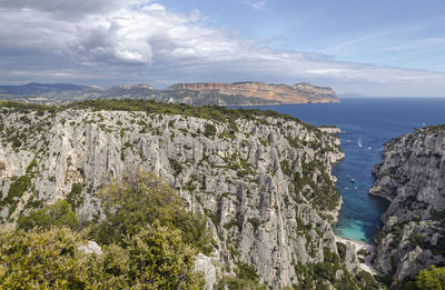Panoramic view of sea and mountains against sky