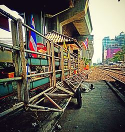 Empty road with buildings in background