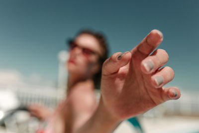 Cropped image of man hand on rock