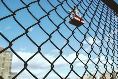 Chainlink fence against blue sky