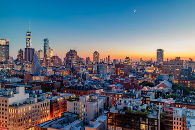 Cityscape against sky during sunset