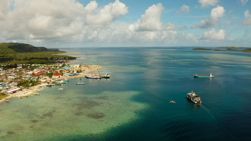 Passenger port with ferries and cargo ships on the island of siargao. dapa ferry terminal