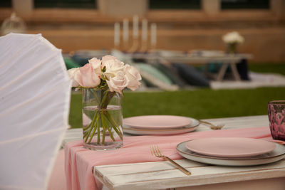 Flower vase on table in restaurant