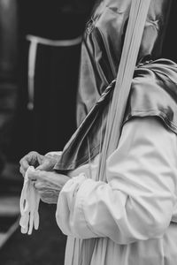 Man wearing traditional clothing in city during celebration