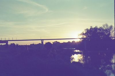 Low angle view of bridge against sky during sunset