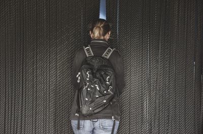 Close-up of man standing on window