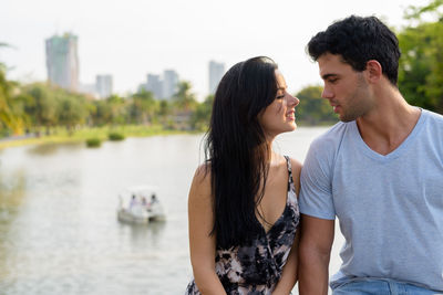 Young couple kissing in water