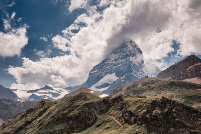 Scenic view of snowcapped mountains against sky