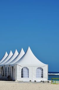 Low angle view of building against clear blue sky