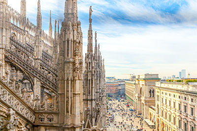 Panoramic view of buildings in city against sky