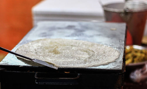 Close-up of dosa cooking pan in commercial kitchen