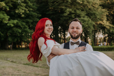 Wedding day. happy bride and groom hugging and laughing red hair diversity