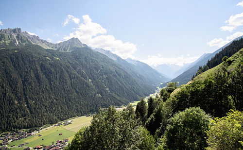 Scenic view of landscape and mountains against sky