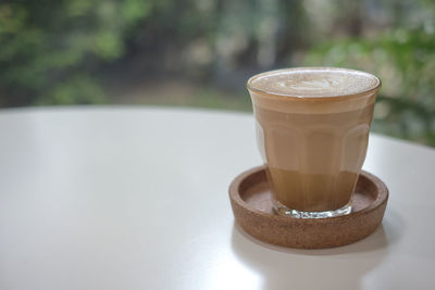 Close-up of coffee cup on table