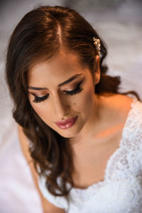 Close-up portrait of a young woman with bride makeup