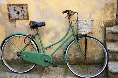 Bicycle parked against wall