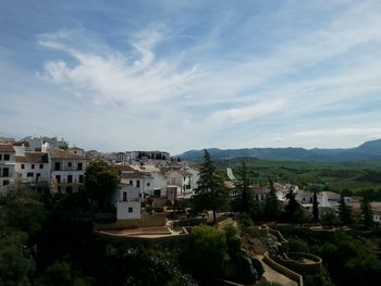 High angle view of town against cloudy sky