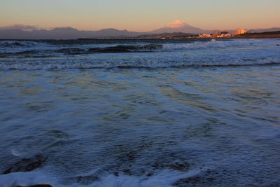 Scenic view of sea at sunset