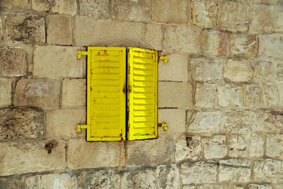 Close-up of yellow brick wall