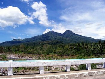 Scenic view of mountains against cloudy sky