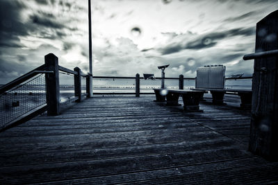 View of jetty on sea against cloudy sky