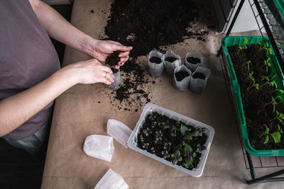 High angle view of woman preparing food on table