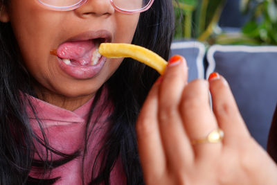 Close-up of woman eating apple