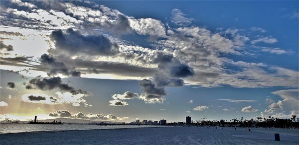 Scenic view of snow covered land against sky