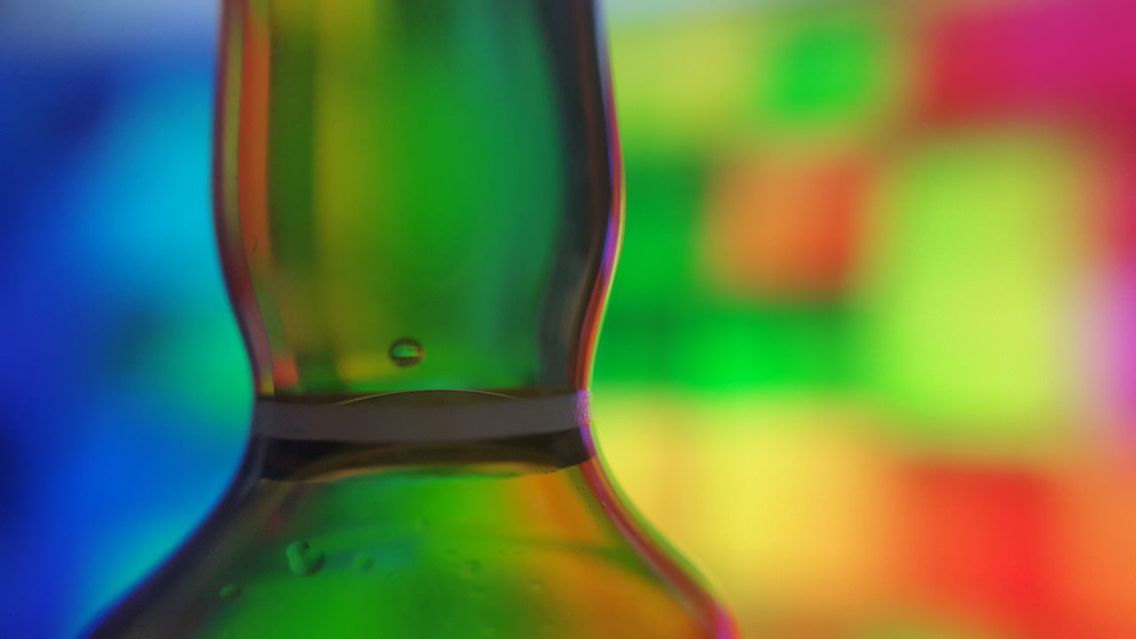 CLOSE-UP OF COLORFUL BOTTLE