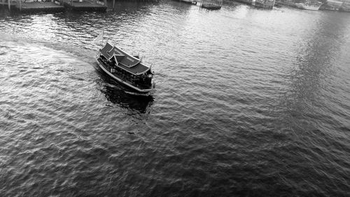 High angle view of boat sailing in sea