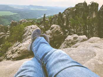 Low section of man on rock
