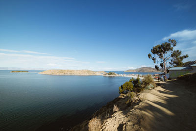 Scenic view of sea against blue sky