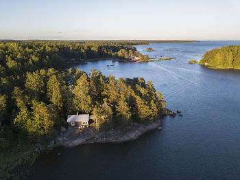High angle view of trees by sea against sky