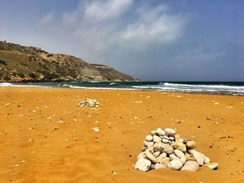 Scenic view of beach against sky